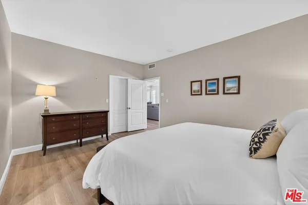 a bedroom with a bed and a cabinets