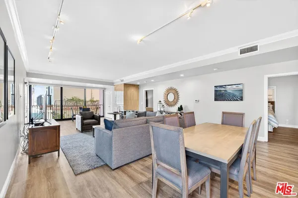 a living room with fireplace furniture and a table