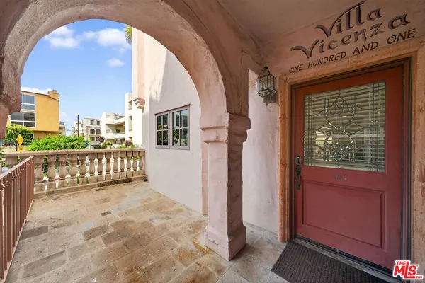 a view of a porch with a wooden fence