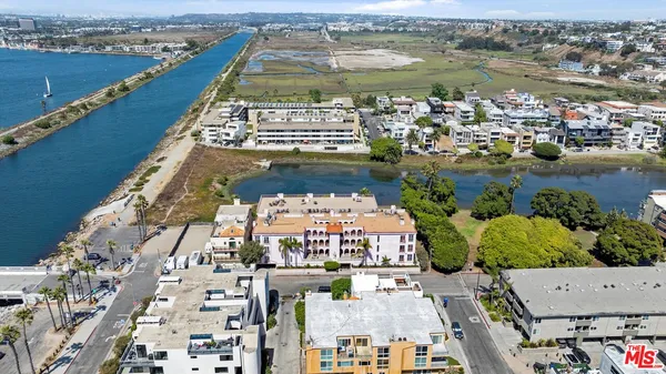 an aerial view of a house with outdoor space