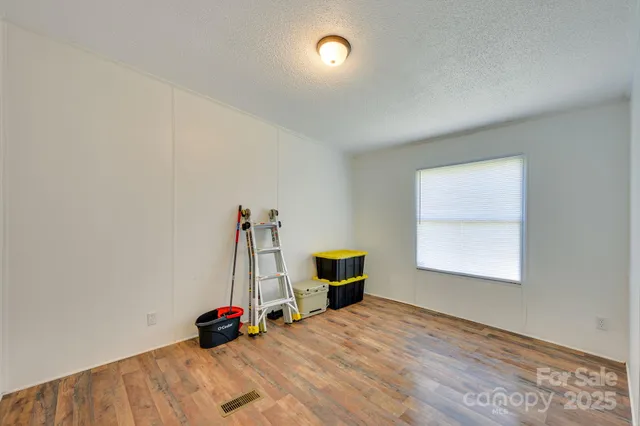 a bed room with a bed and a window