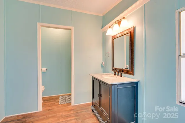 a bathroom with a sink a mirror and a shower