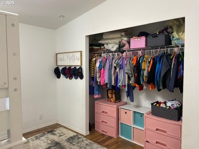 56129 Tom Smith Road Bandon, OR 97411 - Photo 13 of 27 a view of walk in closet with clothes and shoes