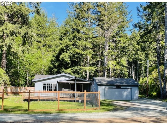56129 Tom Smith Road Bandon, OR 97411 - Photo 19 of 27 front view of house with a yard