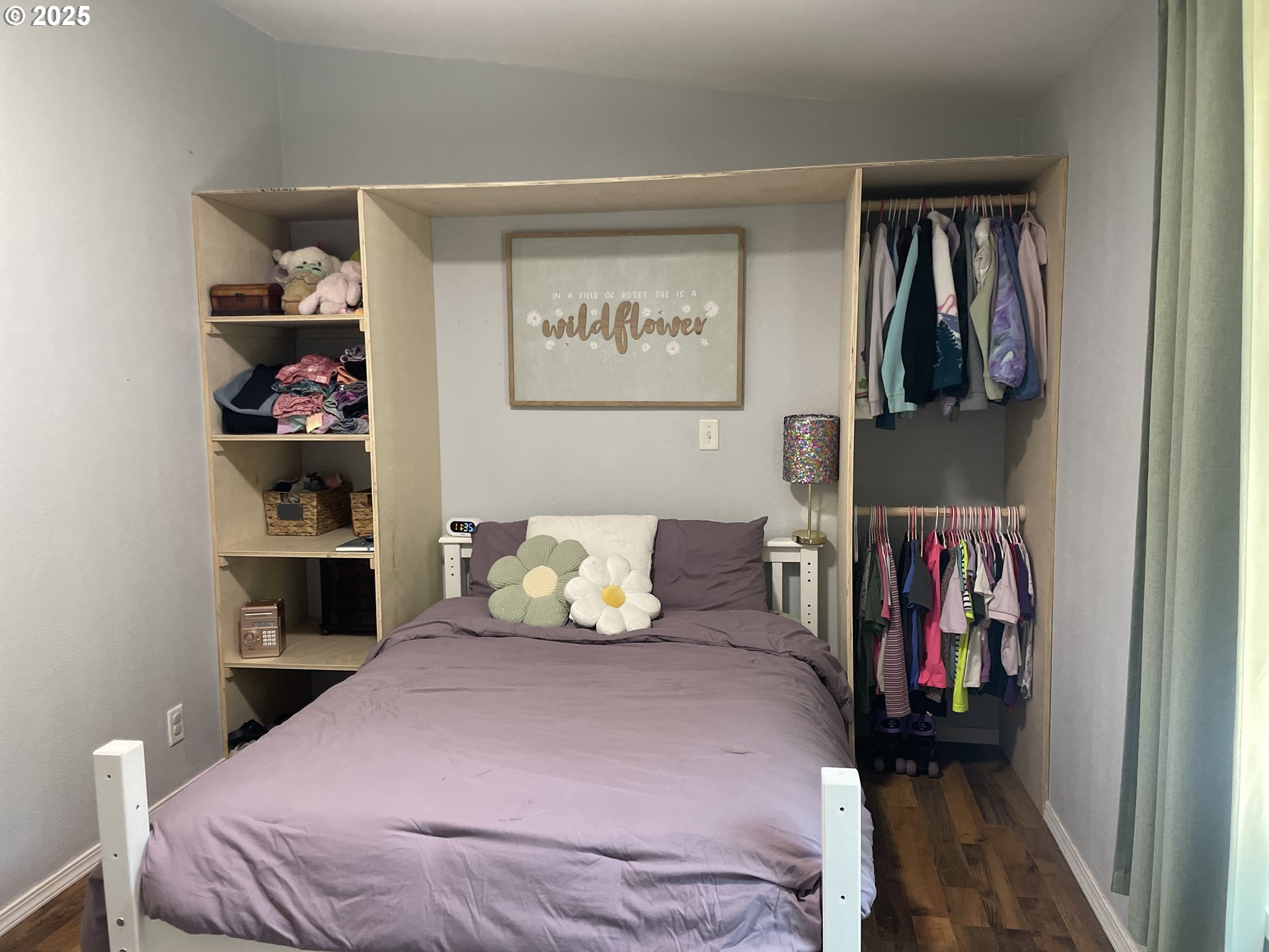 56129 Tom Smith Road Bandon, OR 97411 - Photo 27 of 27 a bedroom with a bed and walk in closet