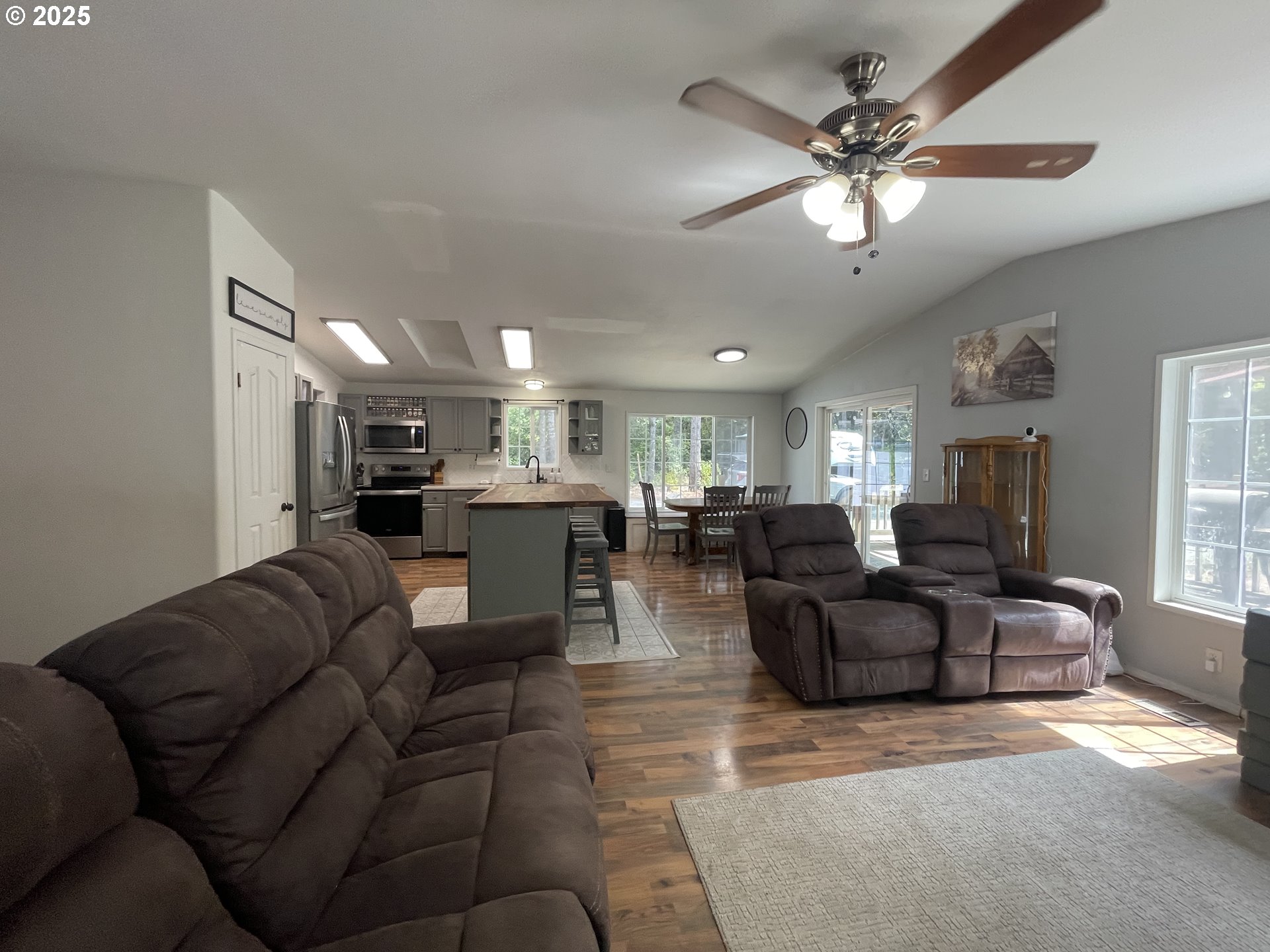 56129 Tom Smith Road Bandon, OR 97411 - Photo 3 of 27 a living room with furniture kitchen view and a chandelier