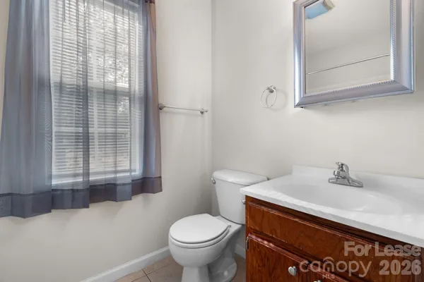 a bathroom with a sink toilet and vanity