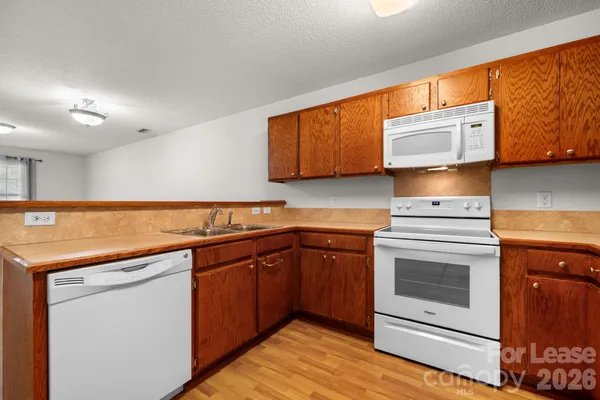 a kitchen with stainless steel appliances granite countertop a sink and cabinets