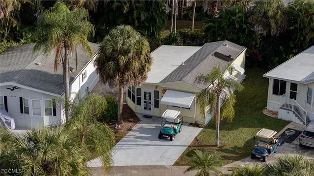 a view of yard with swimming pool and seating area