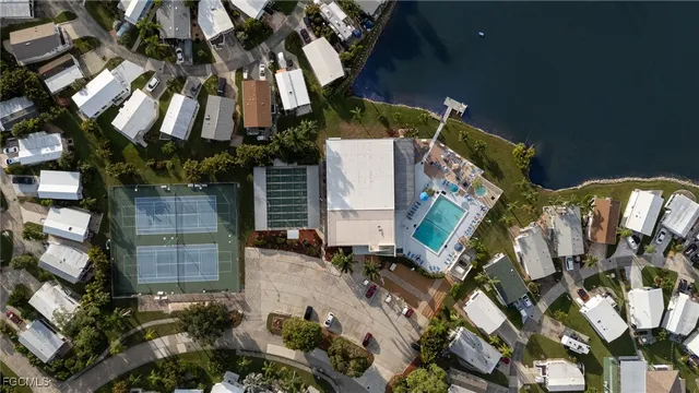 an aerial view of a house with a yard pool outdoor seating oven and outdoor seating