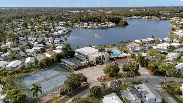 a view of a yard with plants and a fountain