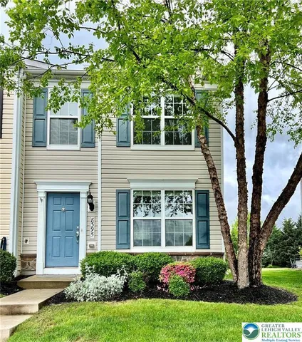 front view of a house with a yard