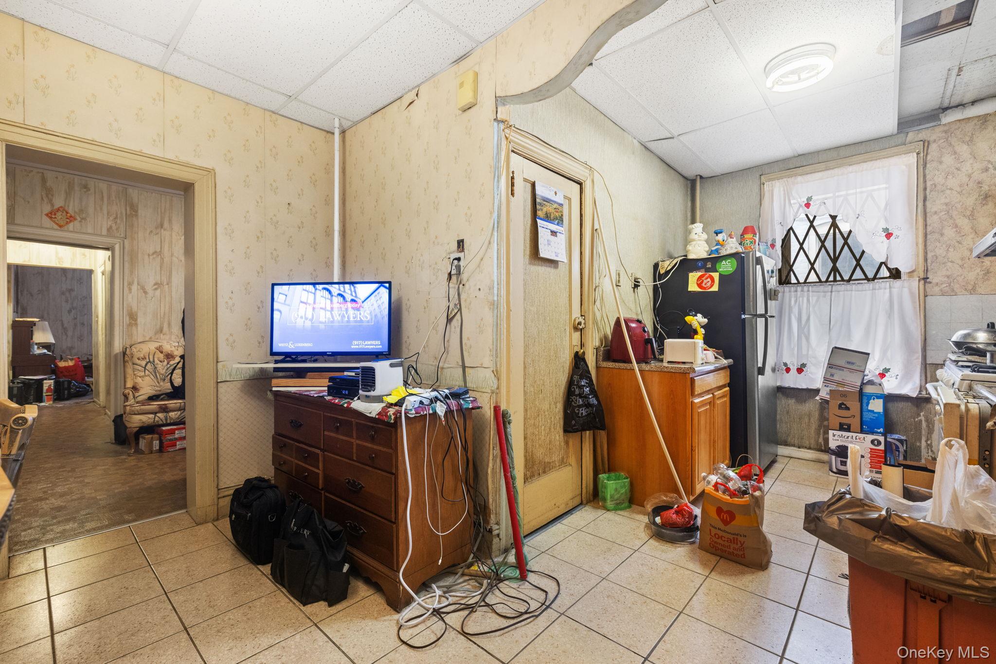 149 Dahill Road Brooklyn, NY 11218 - Photo 25 of 36 a room with furniture and a flat screen tv