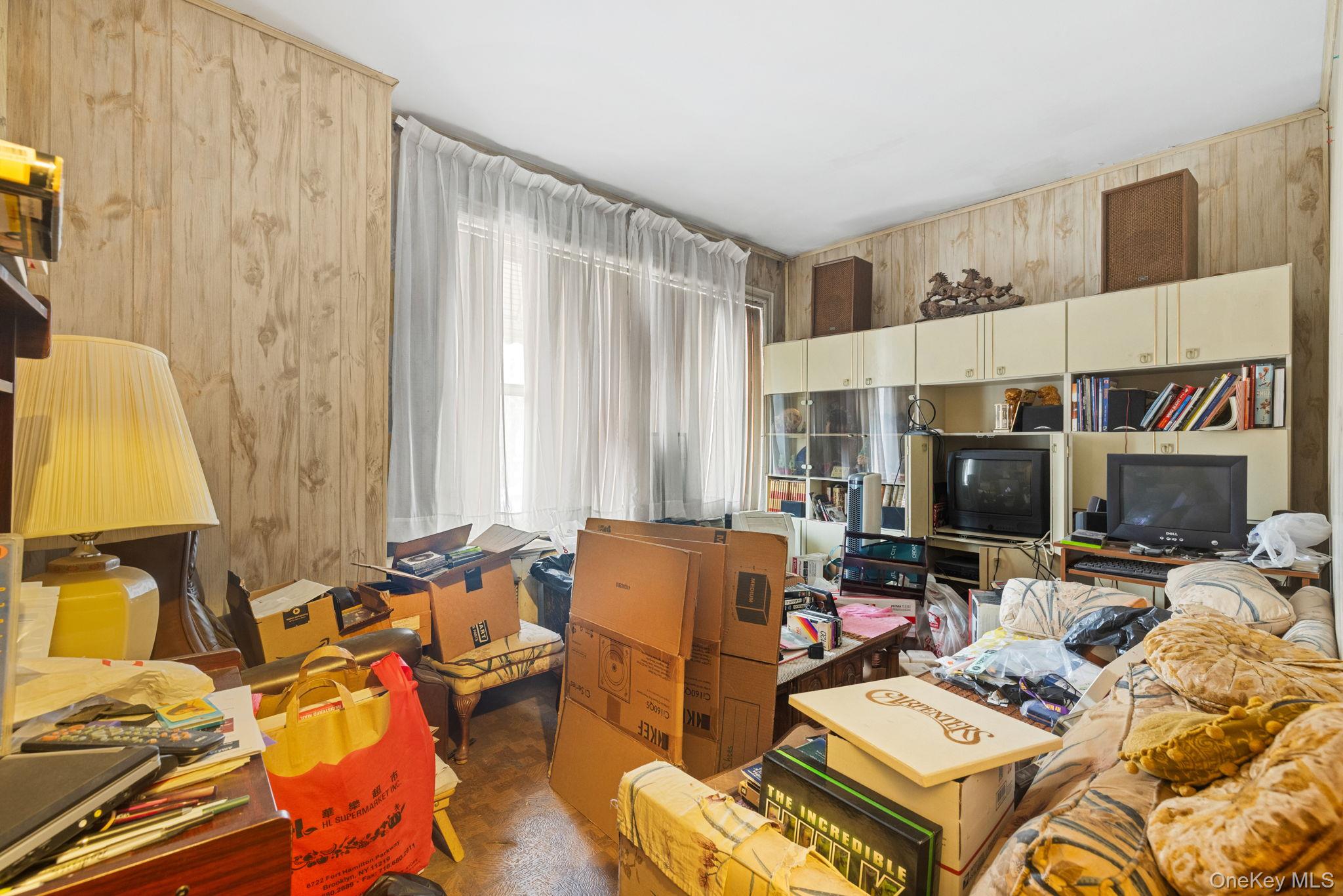 149 Dahill Road Brooklyn, NY 11218 - Photo 30 of 36 a living room with furniture and a flat screen tv