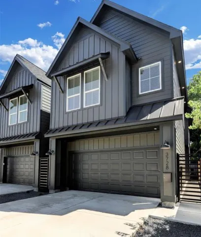 a view of a house with a garage