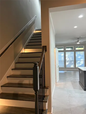 a view of entryway and hall with wooden floor