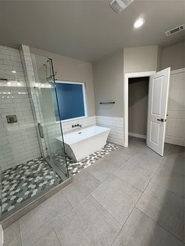 a living room with a washing machine and a granite countertop