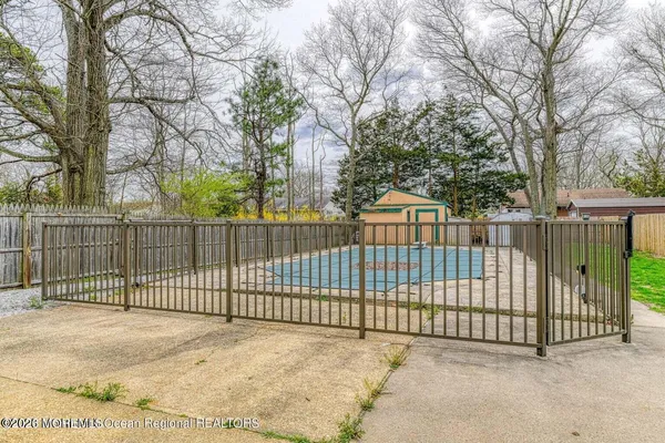 a view of a gate and fence