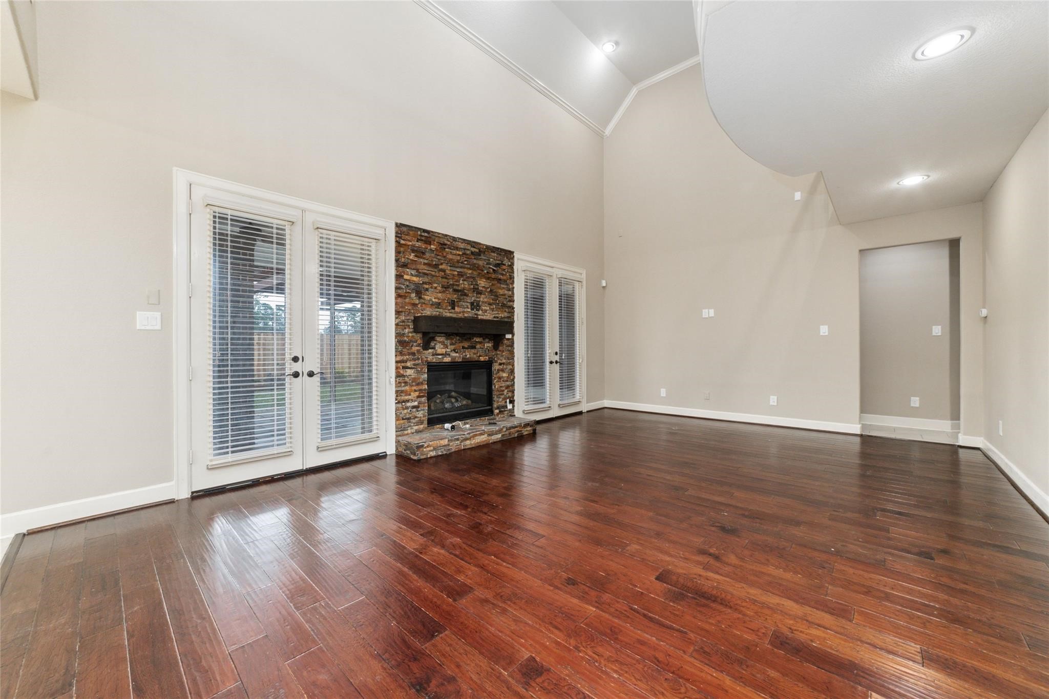 19022 Santa Elena Canyon Court Spring, TX 77388 - Photo 17 of 38 wooden floor in an empty room with a window