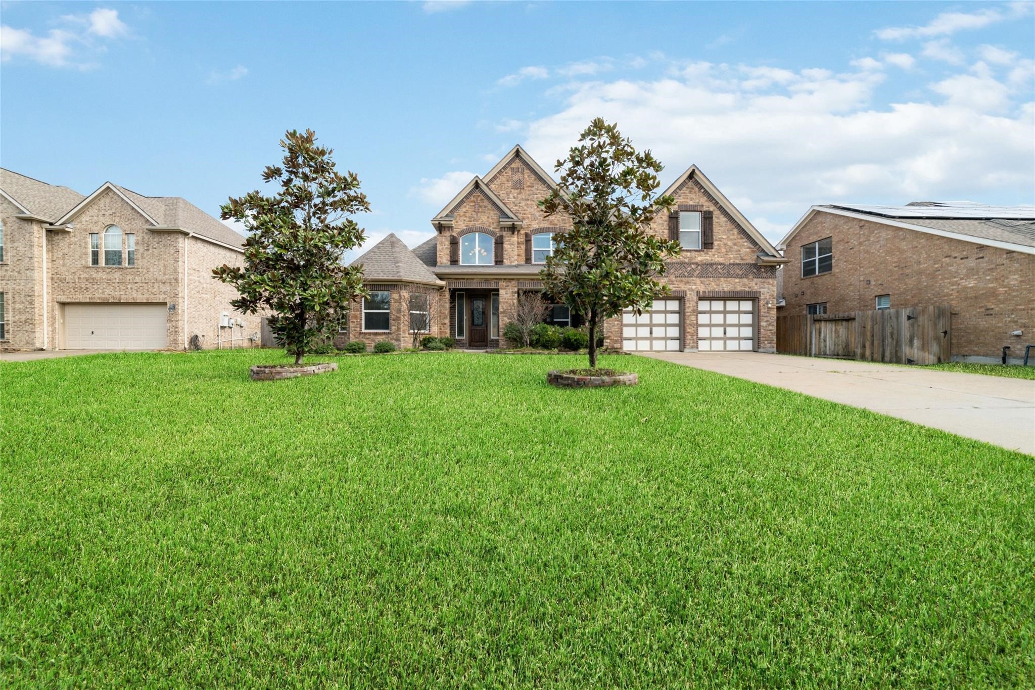 19022 Santa Elena Canyon Court Spring, TX 77388 - Photo 2 of 38 a view of a house with a big yard and potted plants