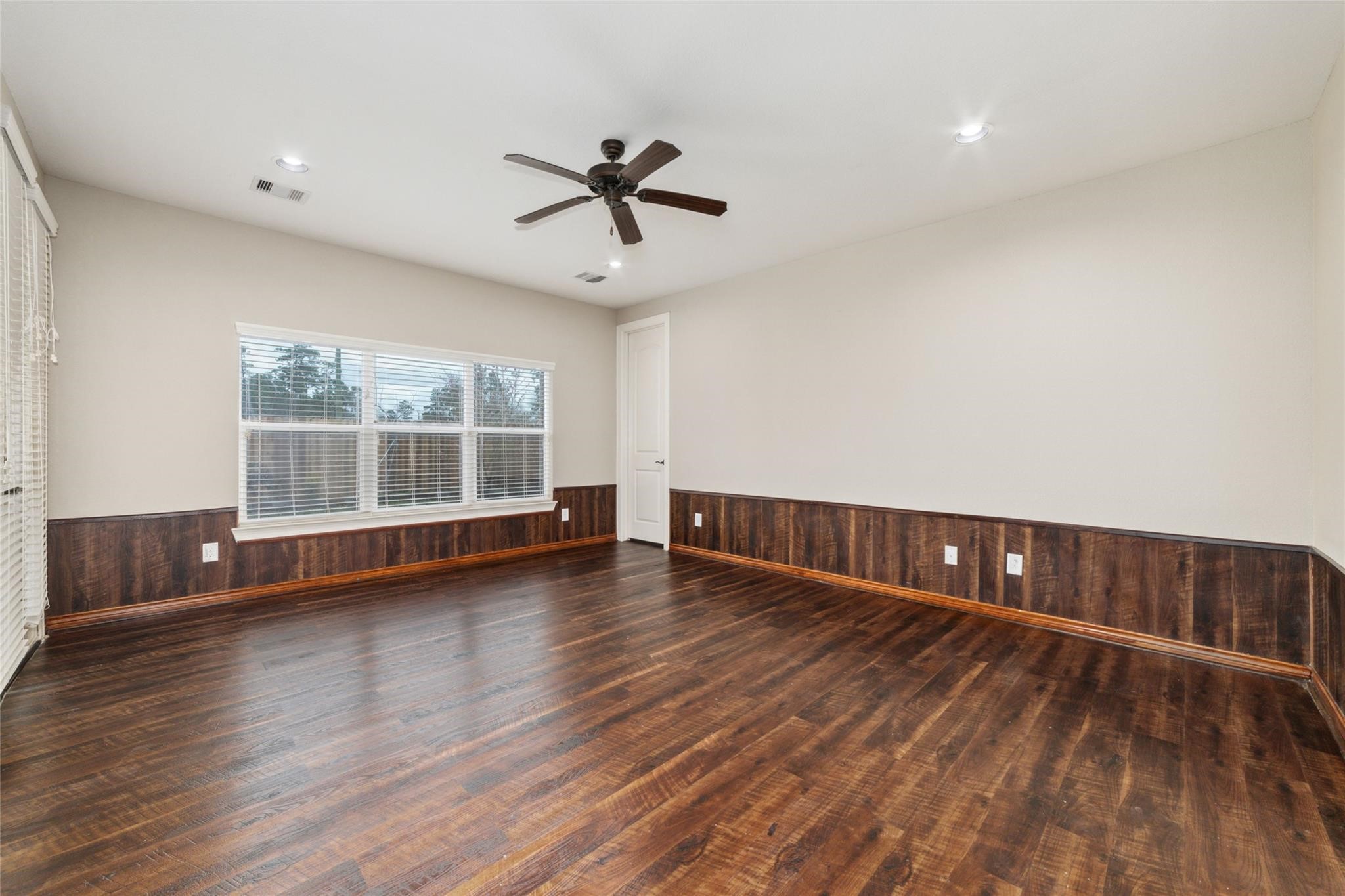 19022 Santa Elena Canyon Court Spring, TX 77388 - Photo 23 of 38 a view of wooden floor and windows in a room