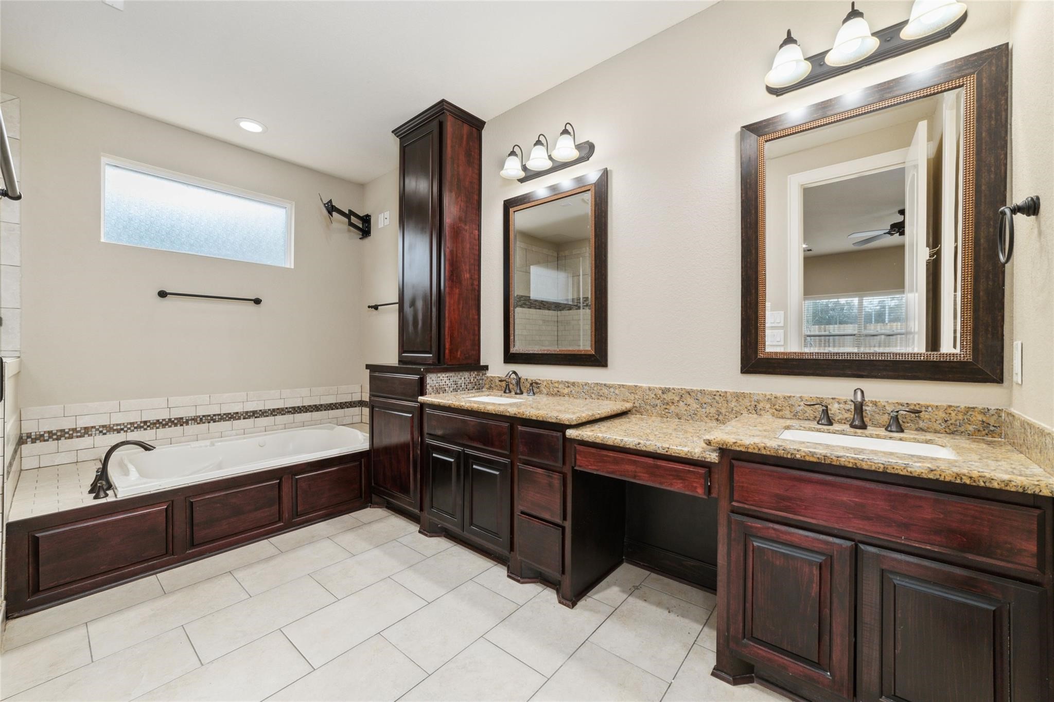 19022 Santa Elena Canyon Court Spring, TX 77388 - Photo 24 of 38 a bathroom with a double vanity sink and a mirror