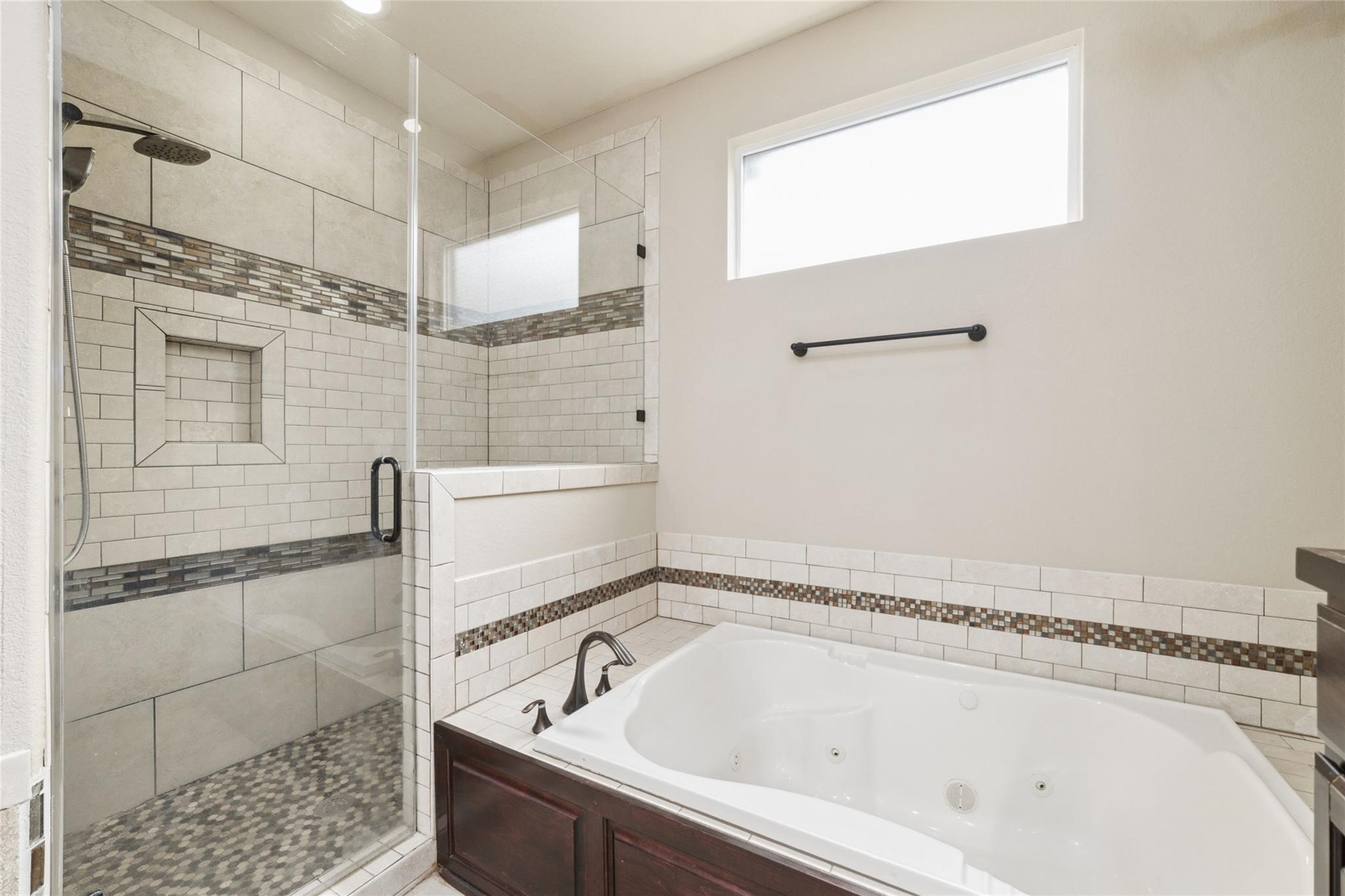 19022 Santa Elena Canyon Court Spring, TX 77388 - Photo 25 of 38 a bathroom with a bathtub and a shower