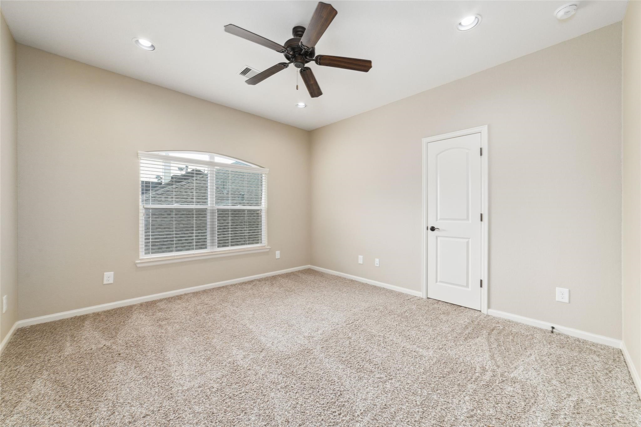 19022 Santa Elena Canyon Court Spring, TX 77388 - Photo 29 of 38 an empty room with windows and fan