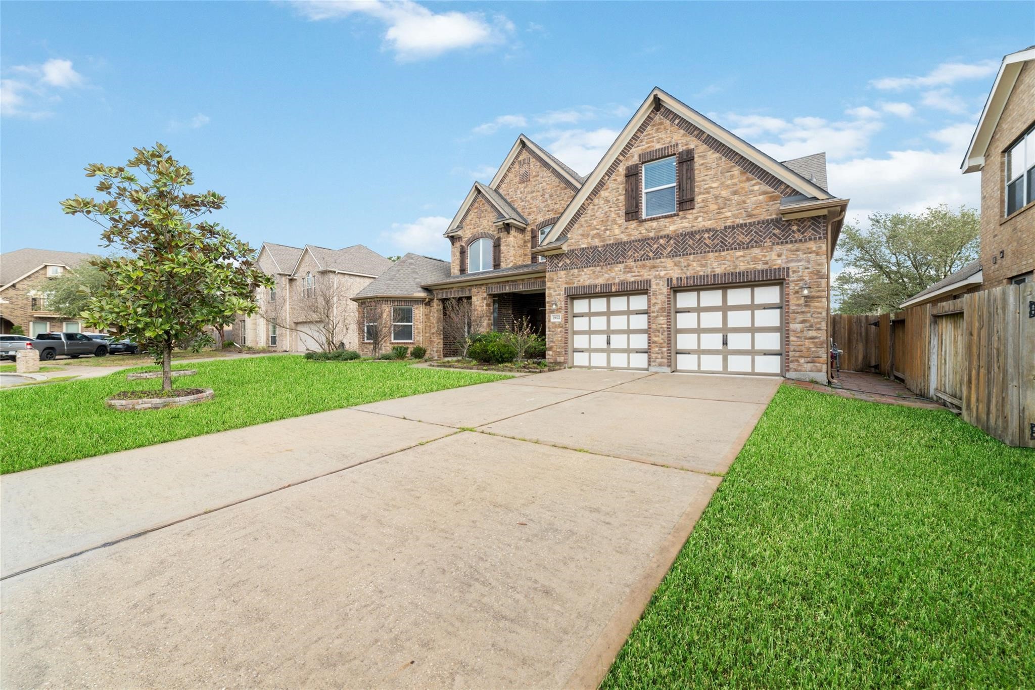 19022 Santa Elena Canyon Court Spring, TX 77388 - Photo 8 of 38 a front view of a house with a yard and garage