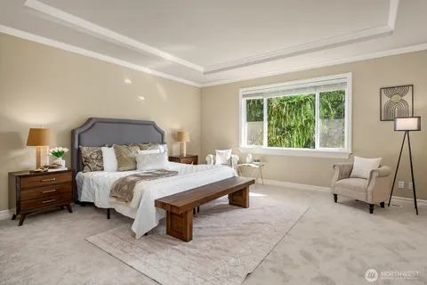 a bedroom with a bed and a couch