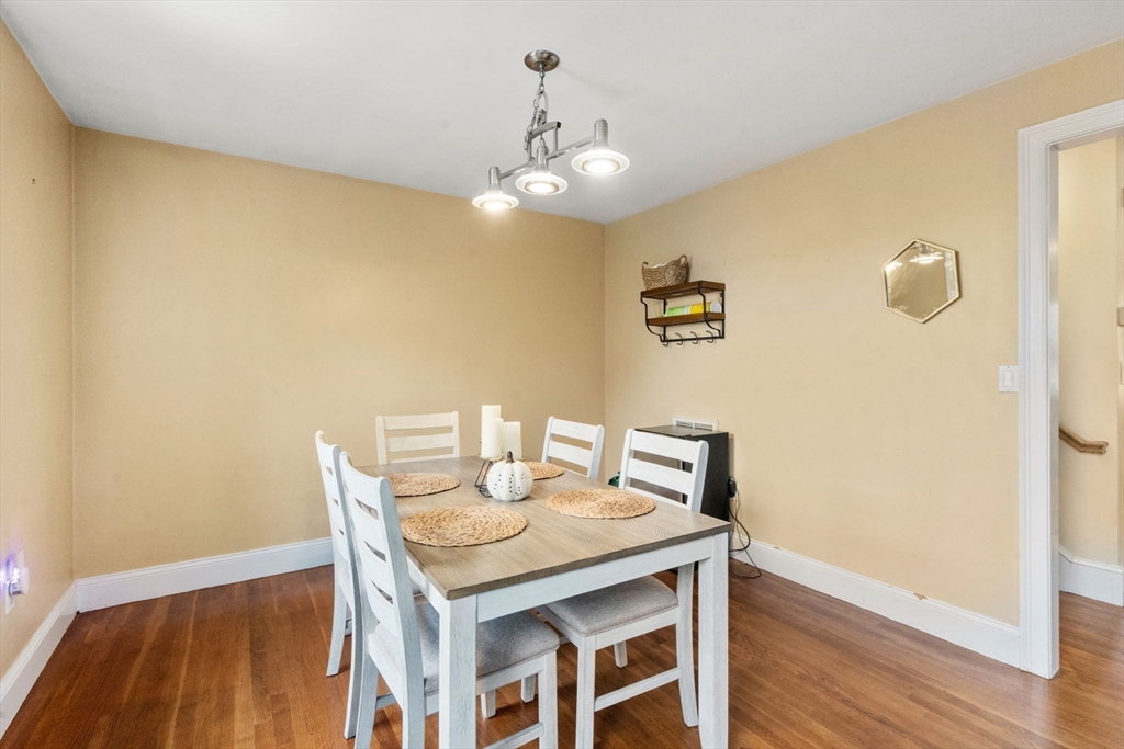 62 Redfield Street, Unit 62 Boston, MA 02122 - Photo 8 of 30 a view of a dining room with furniture and wooden floor