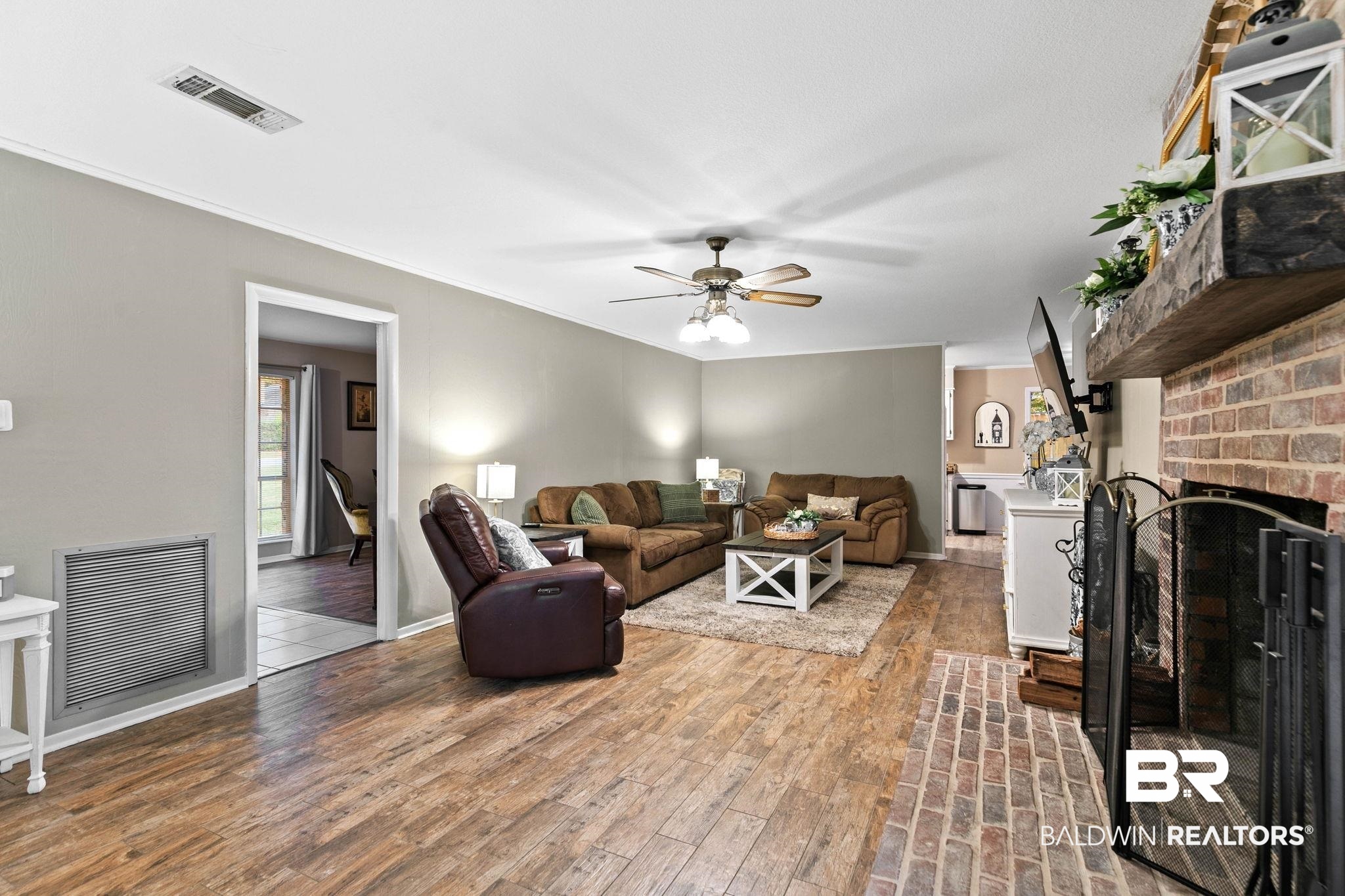 4 Rally Road Spanish Fort, AL 36527 - Photo 10 of 41 Living area with a brick fireplace, light wood finished floors, and ceiling fan