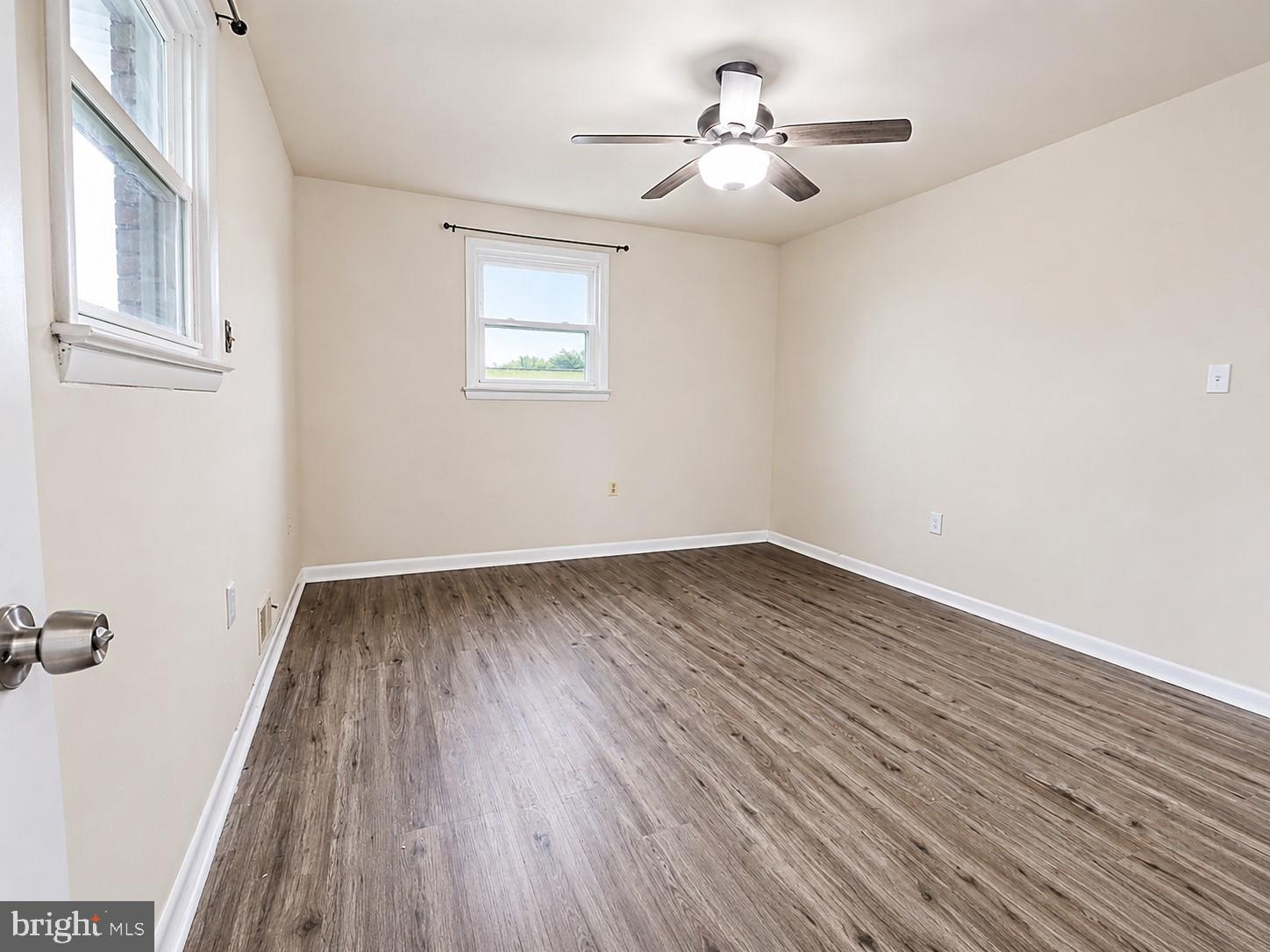 11312 Old Fort Road Fort Washington, MD 20744 - Photo 7 of 13 wooden floor in an empty room with a window