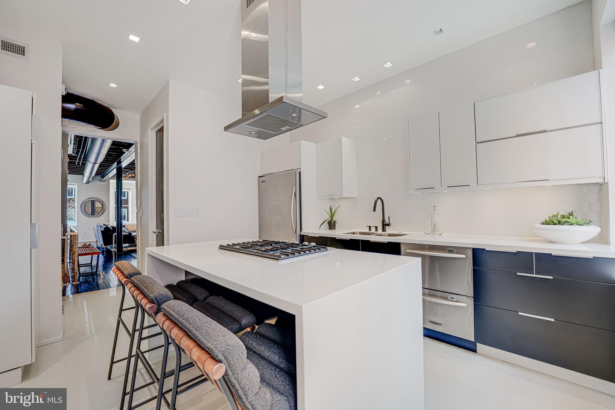 1836 9th Street Northwest, Unit 2 Washington, DC 20001 - Photo 13 of 30 a kitchen with a stove a sink and a refrigerator