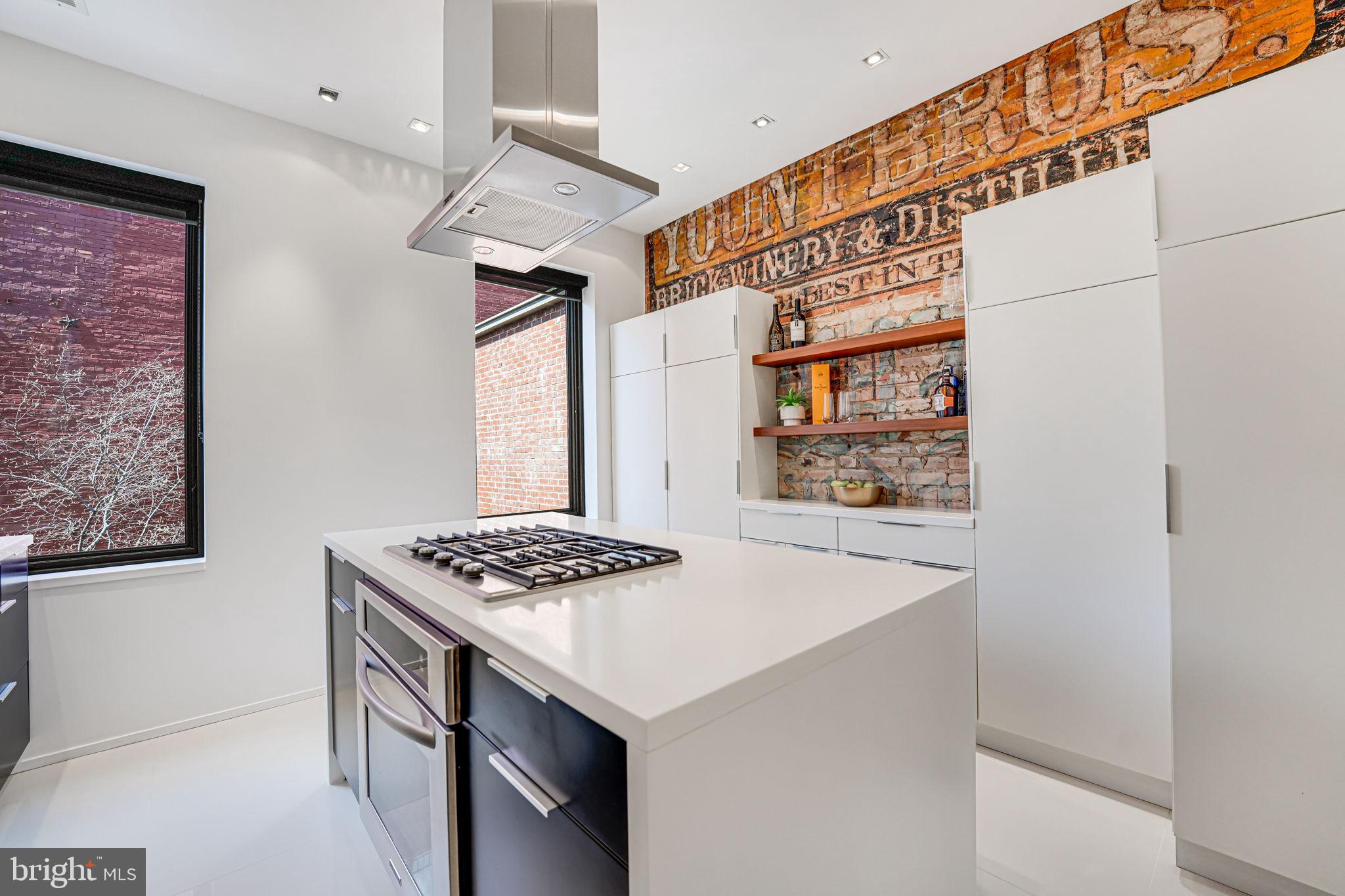 1836 9th Street Northwest, Unit 2 Washington, DC 20001 - Photo 15 of 30 a kitchen that has a stove and a table in it