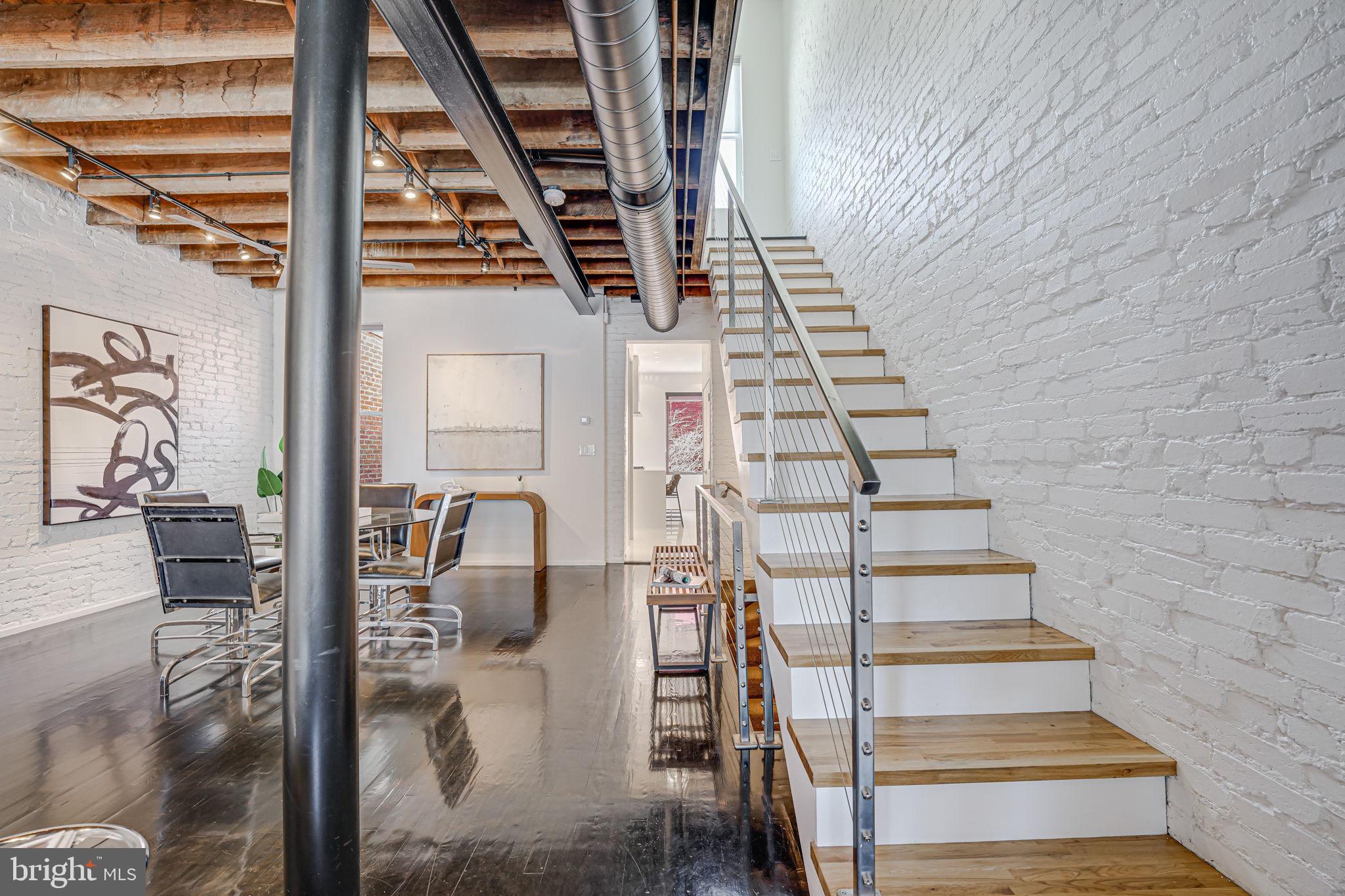 1836 9th Street Northwest, Unit 2 Washington, DC 20001 - Photo 23 of 30 a view of entryway and hall with wooden floor