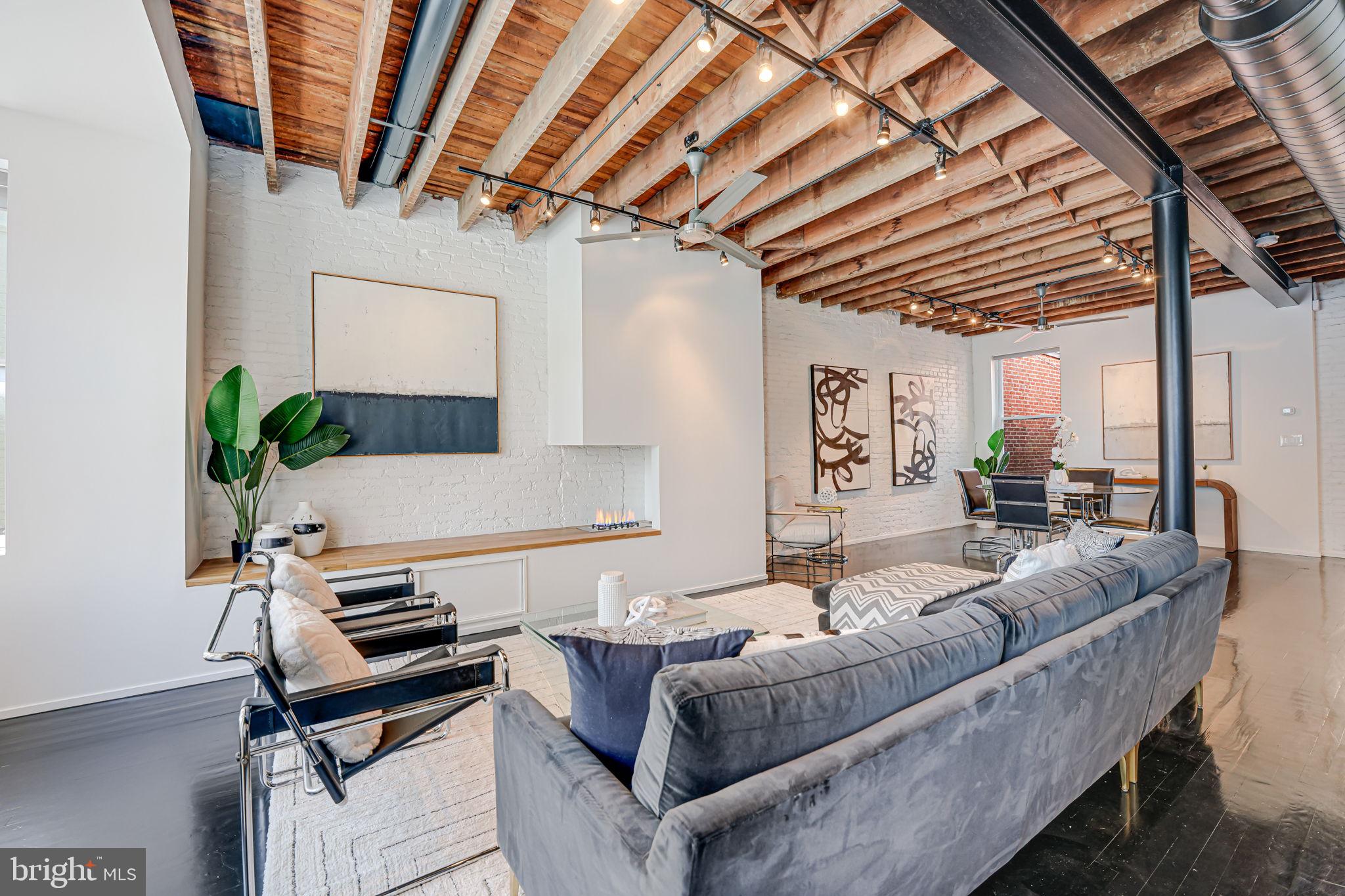 1836 9th Street Northwest, Unit 2 Washington, DC 20001 - Photo 5 of 30 a living room with furniture a ceiling fan and a rug