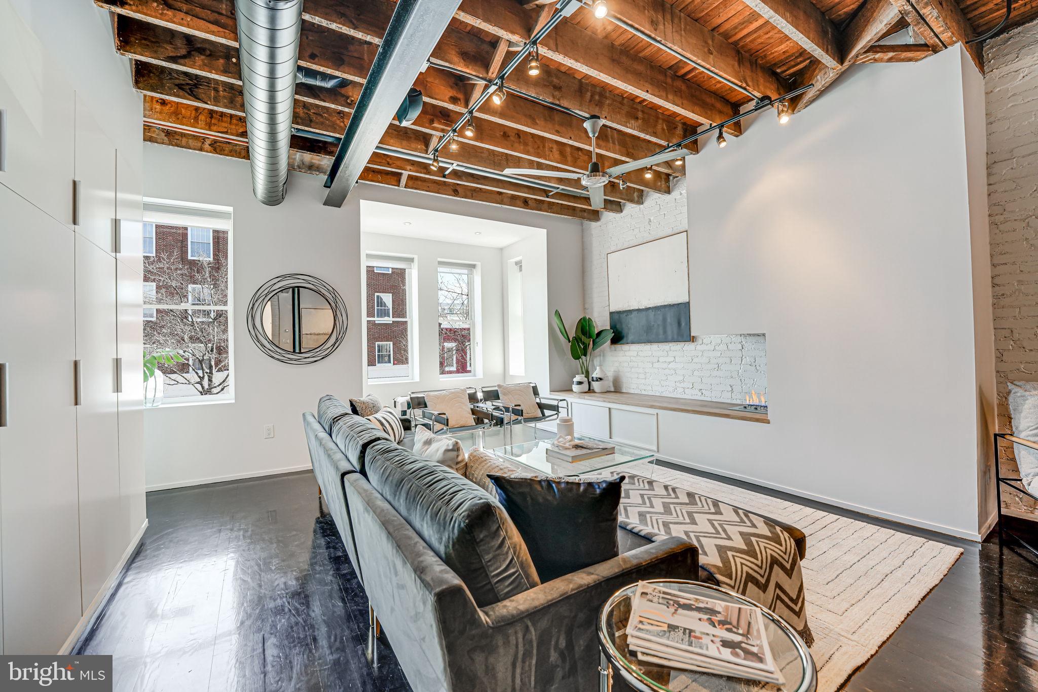 1836 9th Street Northwest, Unit 2 Washington, DC 20001 - Photo 6 of 30 a living room with furniture and a window