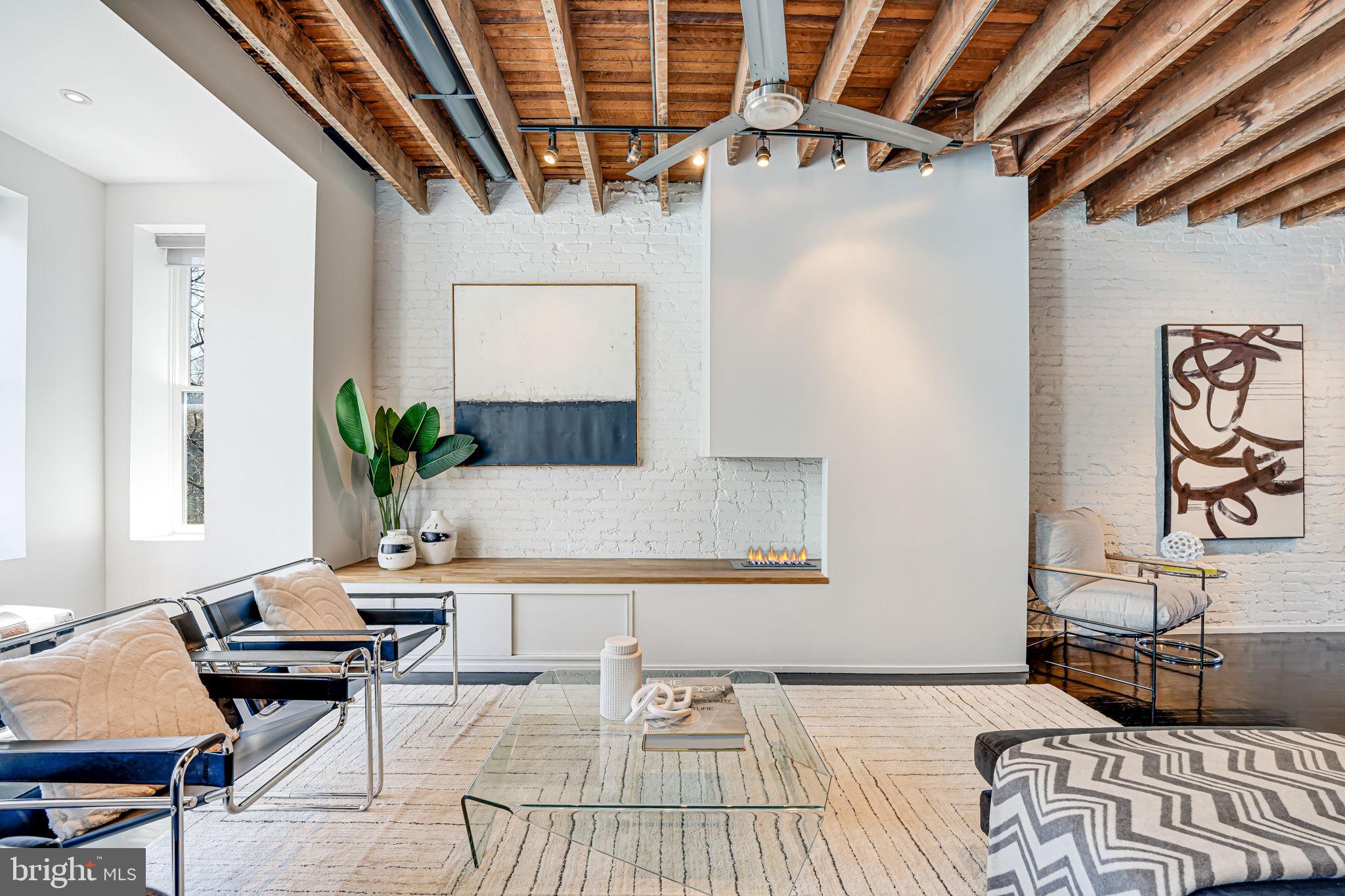 1836 9th Street Northwest, Unit 2 Washington, DC 20001 - Photo 7 of 30 a living room with furniture and wooden floor