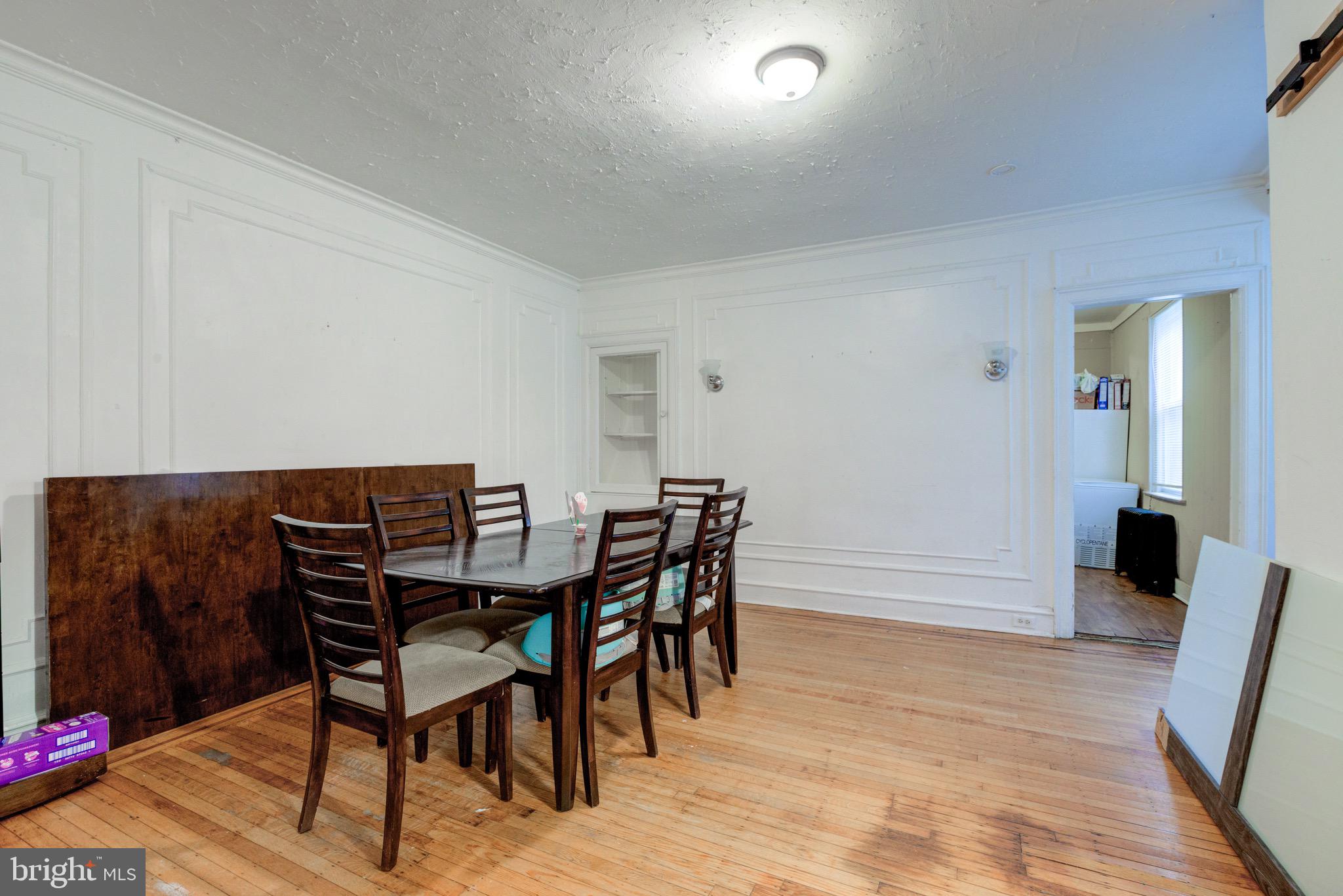 6209 Carpenter Street Philadelphia, PA 19143 - Photo 14 of 44 a view of a dining room with furniture and wooden floor