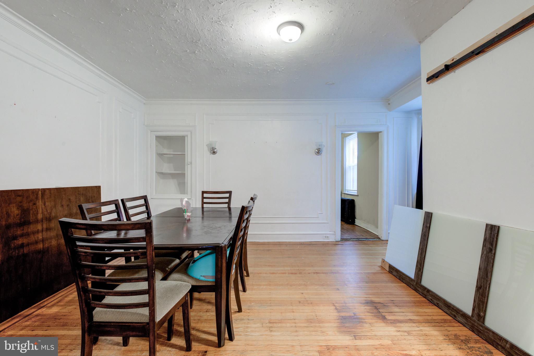 6209 Carpenter Street Philadelphia, PA 19143 - Photo 15 of 44 a view of a dining room with furniture and wooden floor