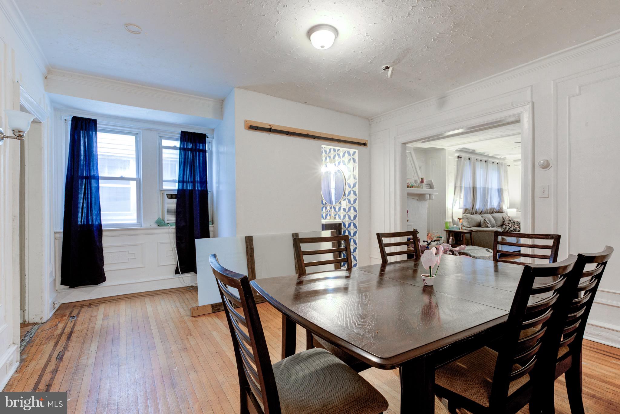 6209 Carpenter Street Philadelphia, PA 19143 - Photo 16 of 44 a dining room with furniture and wooden floor