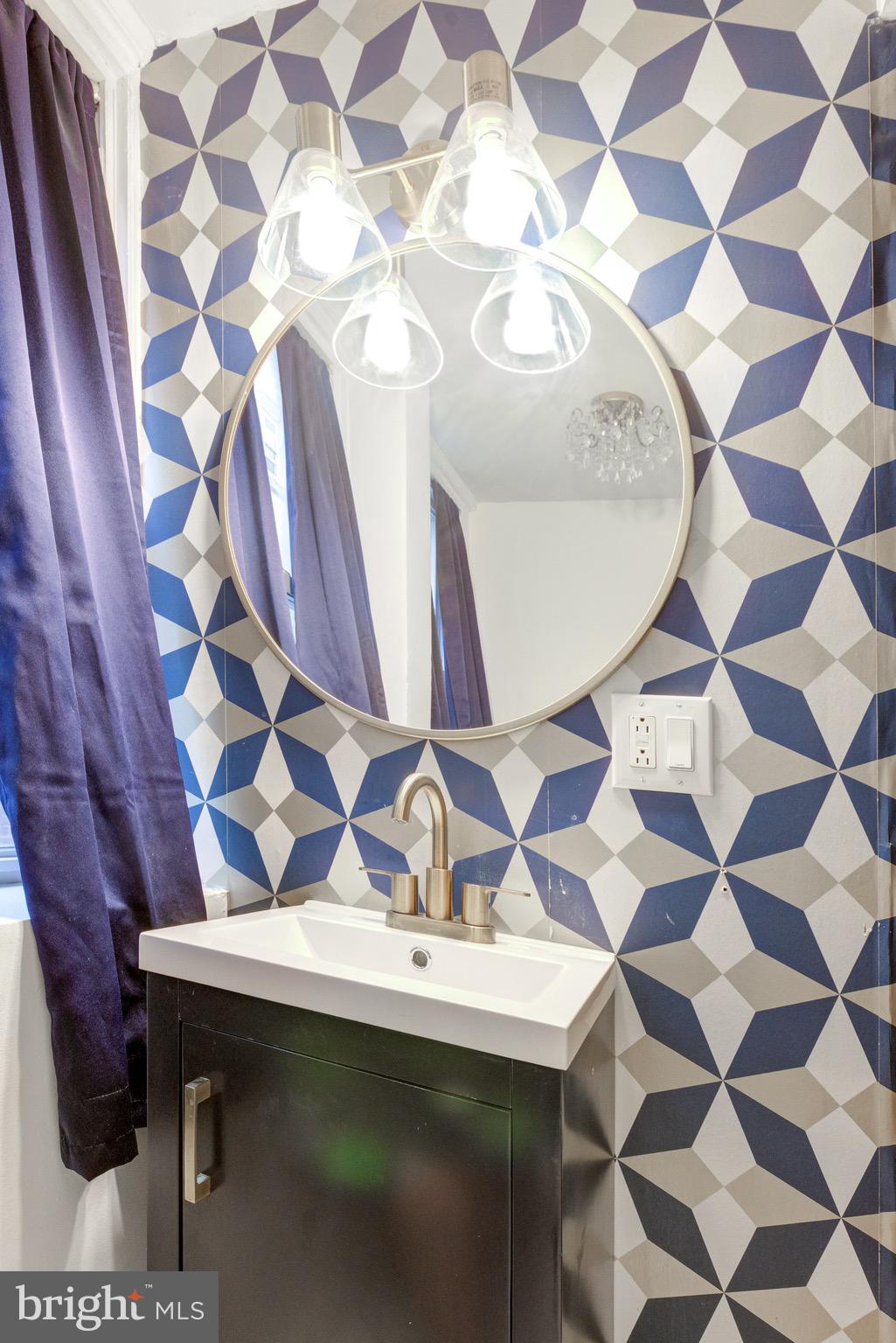 6209 Carpenter Street Philadelphia, PA 19143 - Photo 18 of 44 a bathroom with a sink and a mirror