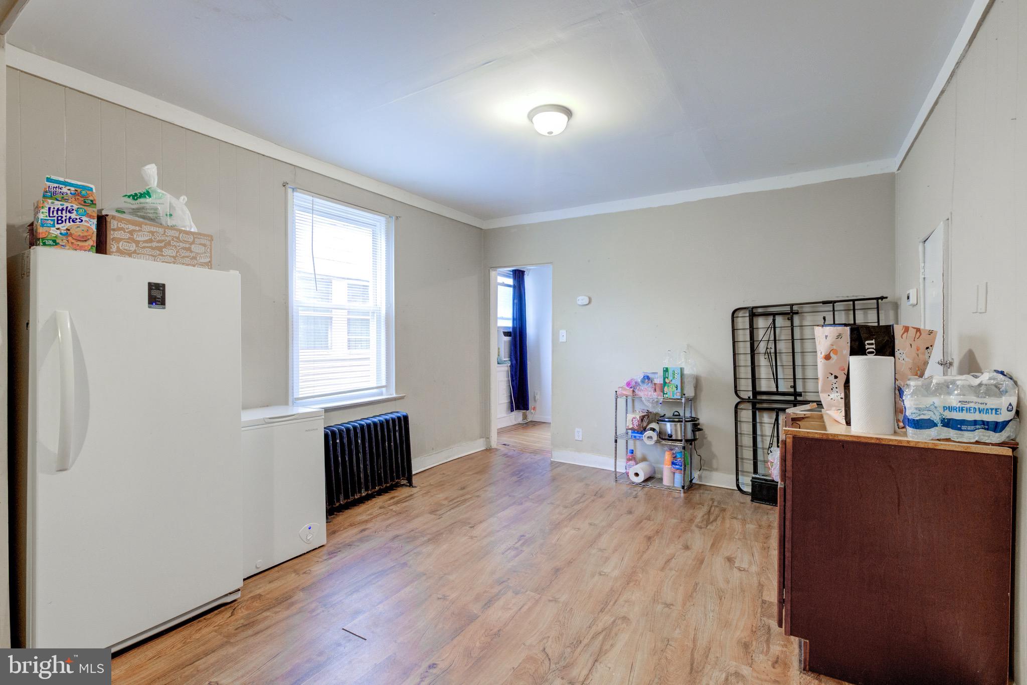 6209 Carpenter Street Philadelphia, PA 19143 - Photo 20 of 44 a view of a livingroom with furniture hardwood floor and workspace
