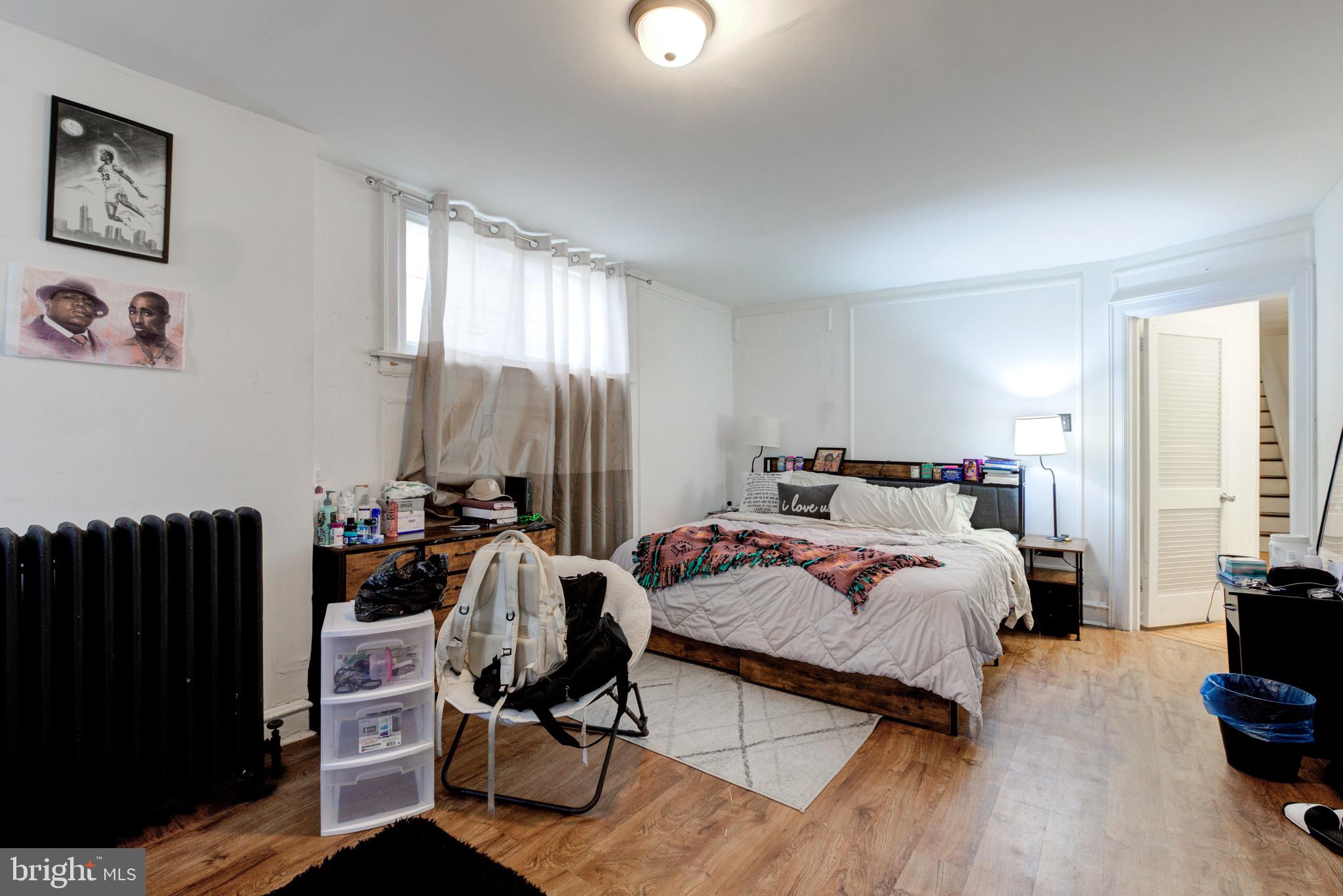 6209 Carpenter Street Philadelphia, PA 19143 - Photo 25 of 44 a bedroom with a bed and a window
