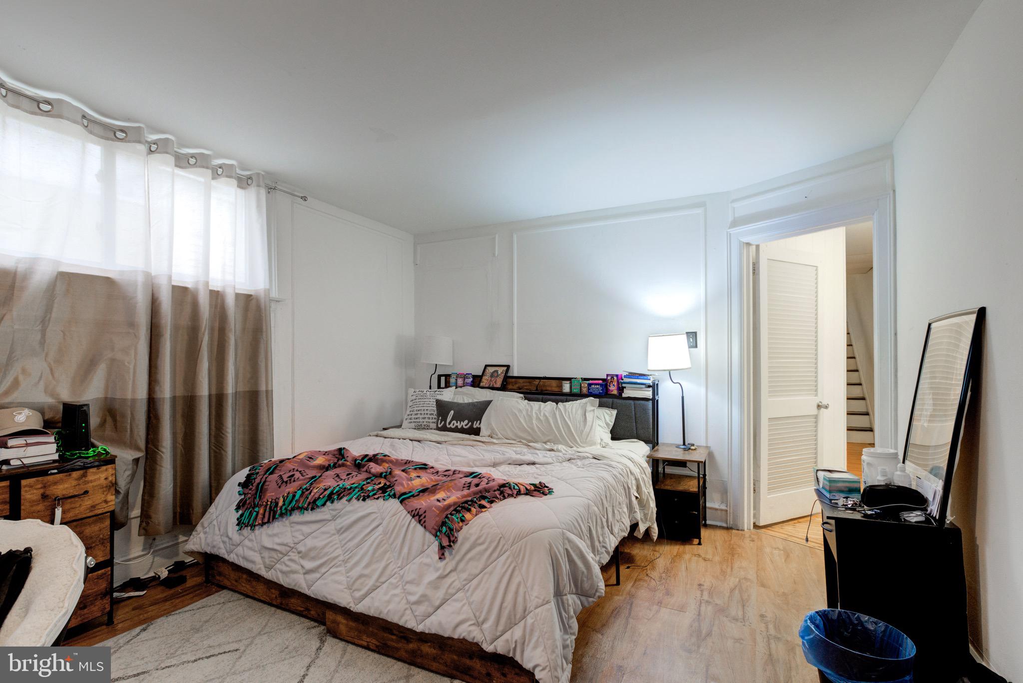 6209 Carpenter Street Philadelphia, PA 19143 - Photo 26 of 44 a bedroom with a bed and a flat screen tv
