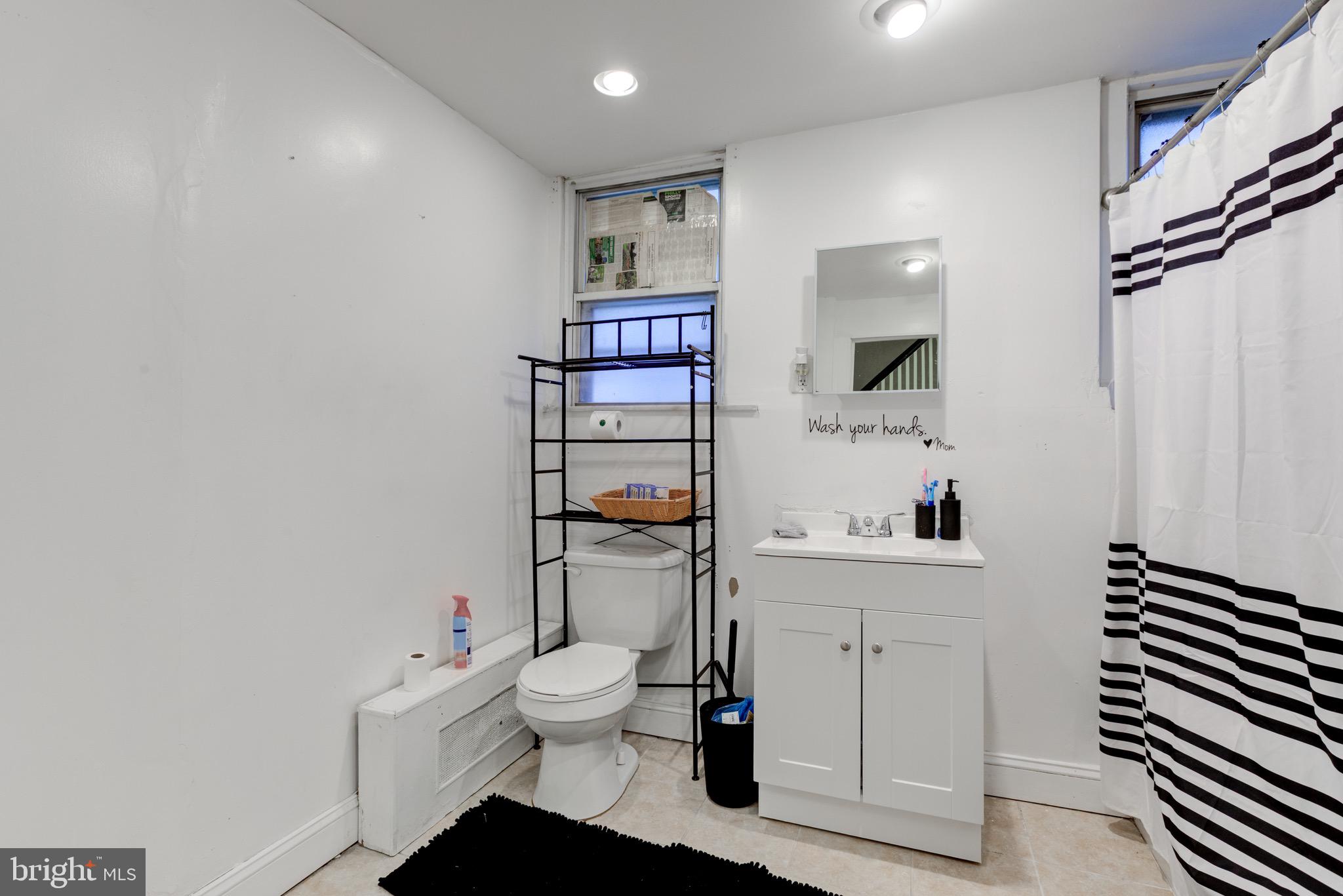 6209 Carpenter Street Philadelphia, PA 19143 - Photo 27 of 44 a hallway with a white cabinets and white appliances