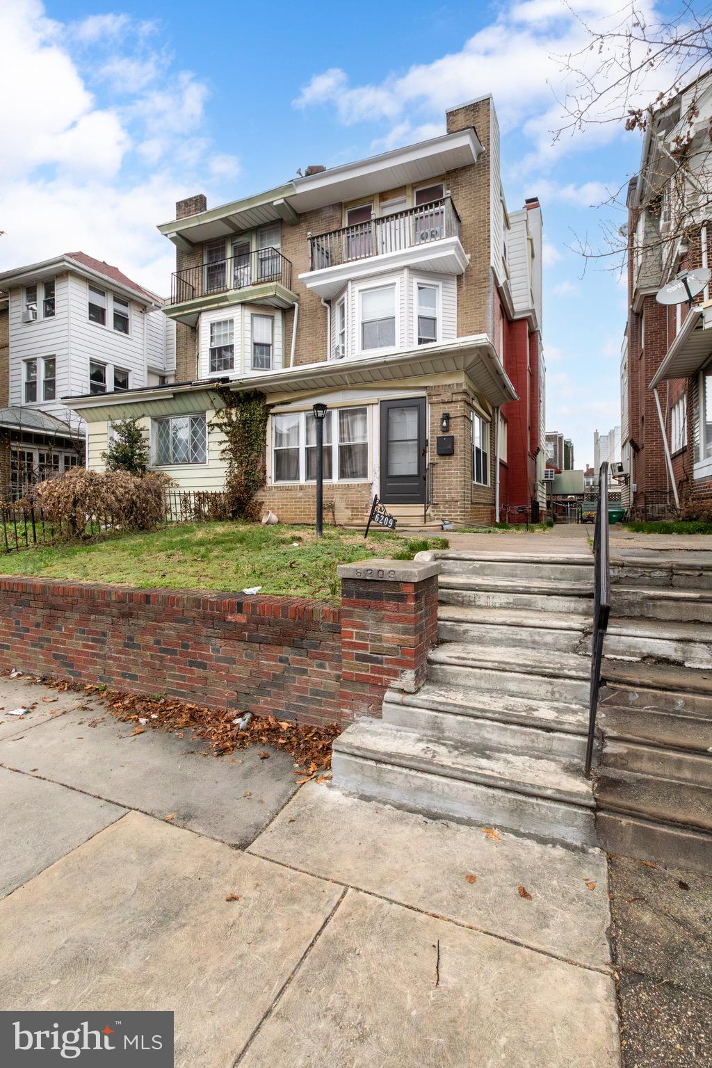 6209 Carpenter Street Philadelphia, PA 19143 - Photo 3 of 44 a front view of a building with street view