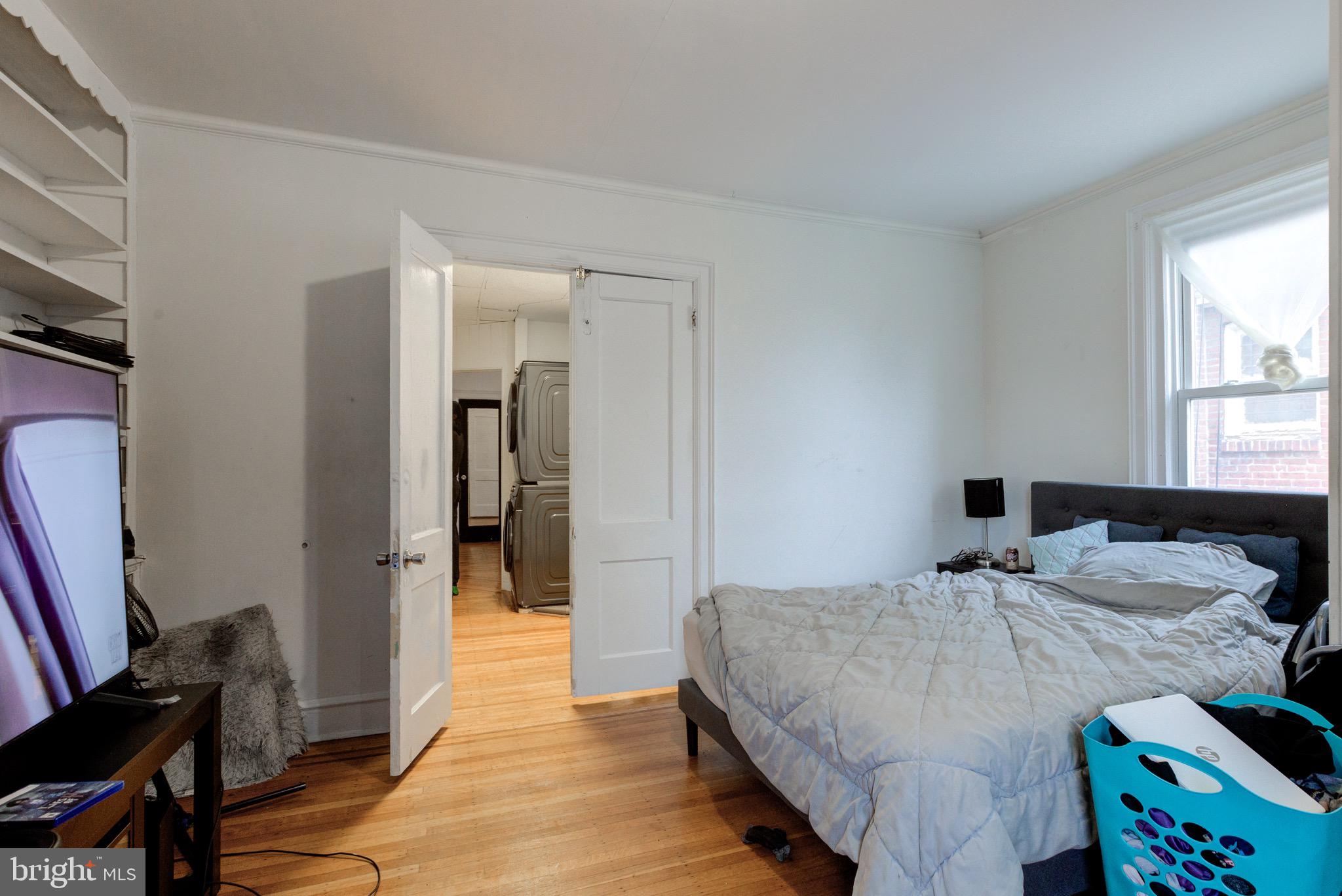 6209 Carpenter Street Philadelphia, PA 19143 - Photo 33 of 44 a bedroom with a bed and a window