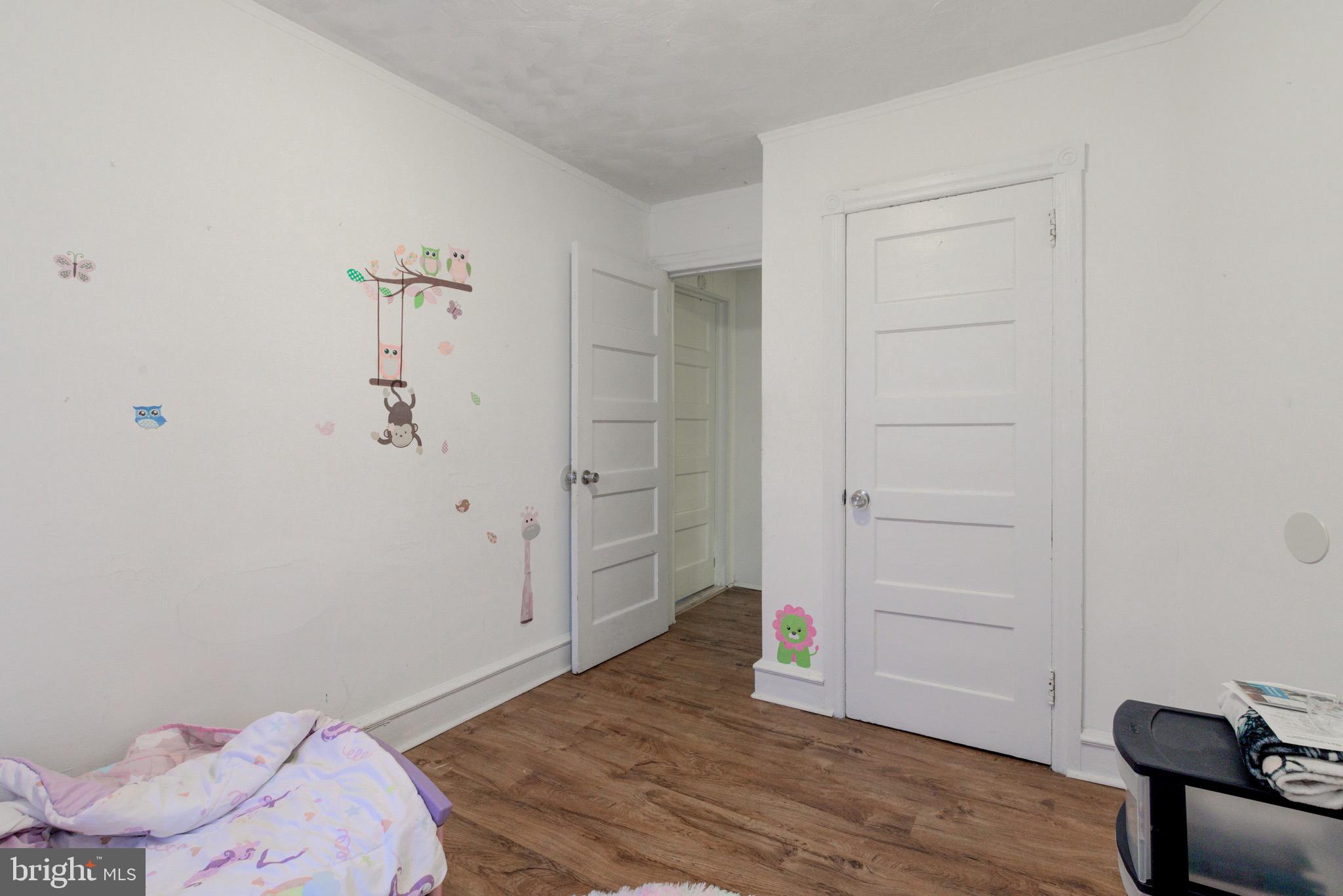 6209 Carpenter Street Philadelphia, PA 19143 - Photo 38 of 44 an empty room with a wooden floor and closet